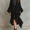 Elegante vestido midi bohemio negro asimétrico con pliegues
